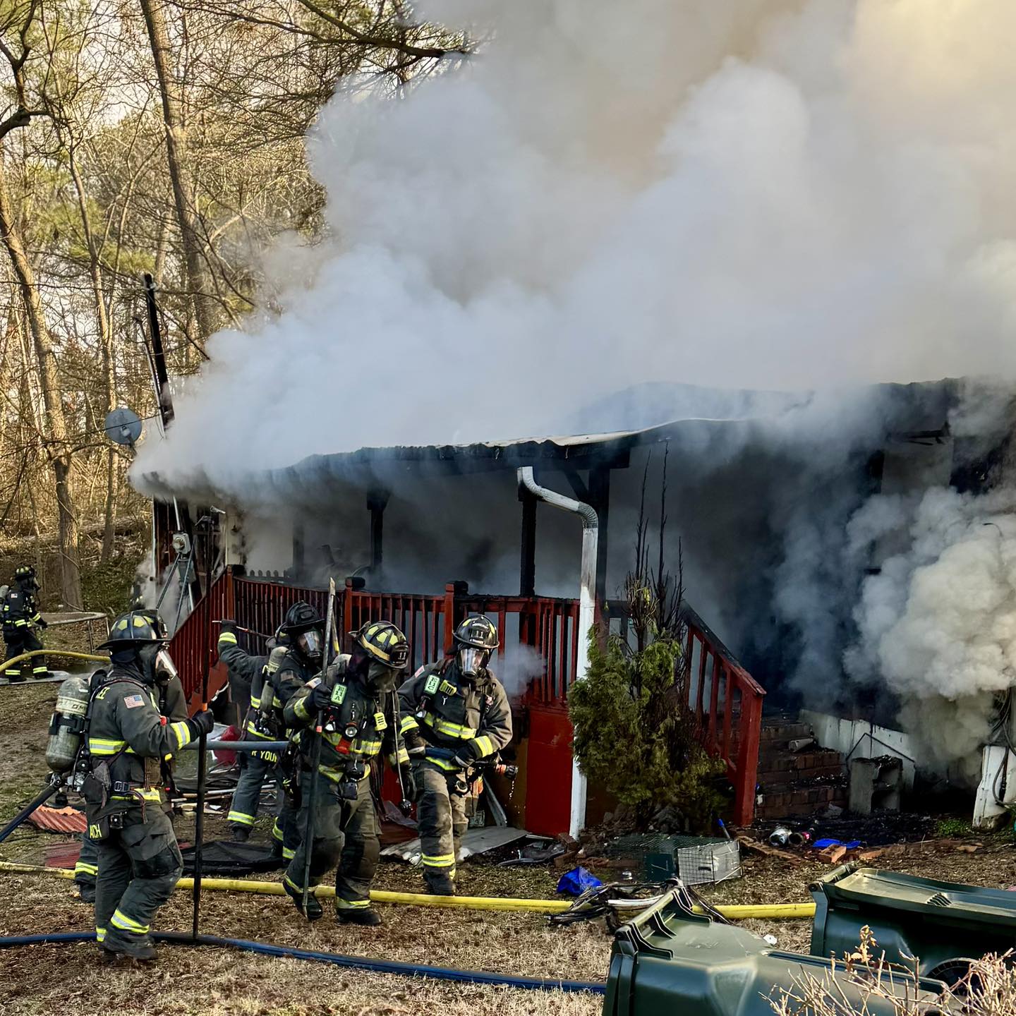 Firefighters work at the scene of a structure fire