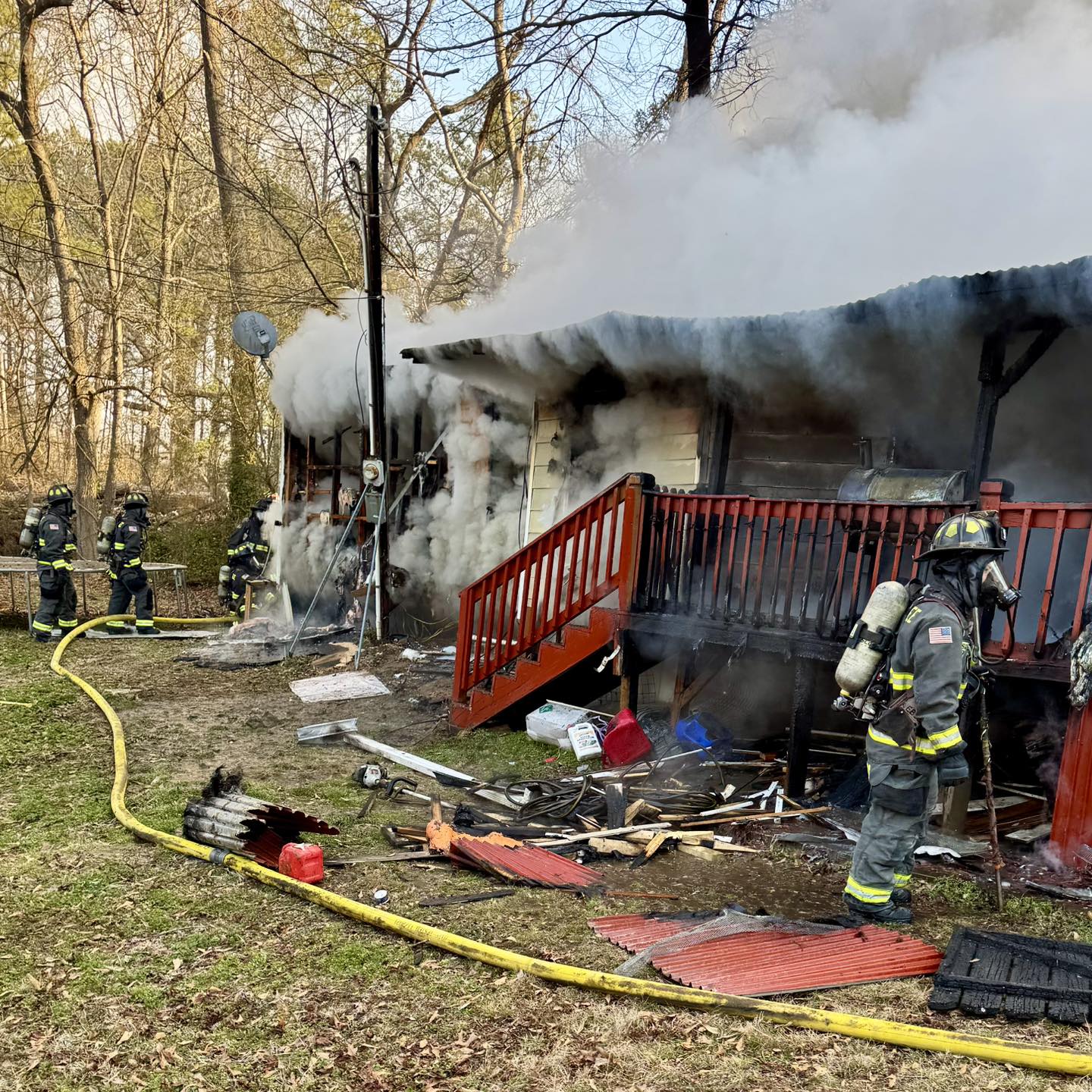 Firefighters work at the scene of a structure fire