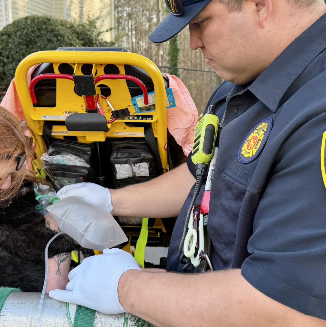 Paramedic Garrett tends to a cat that was rescued from the fire. 