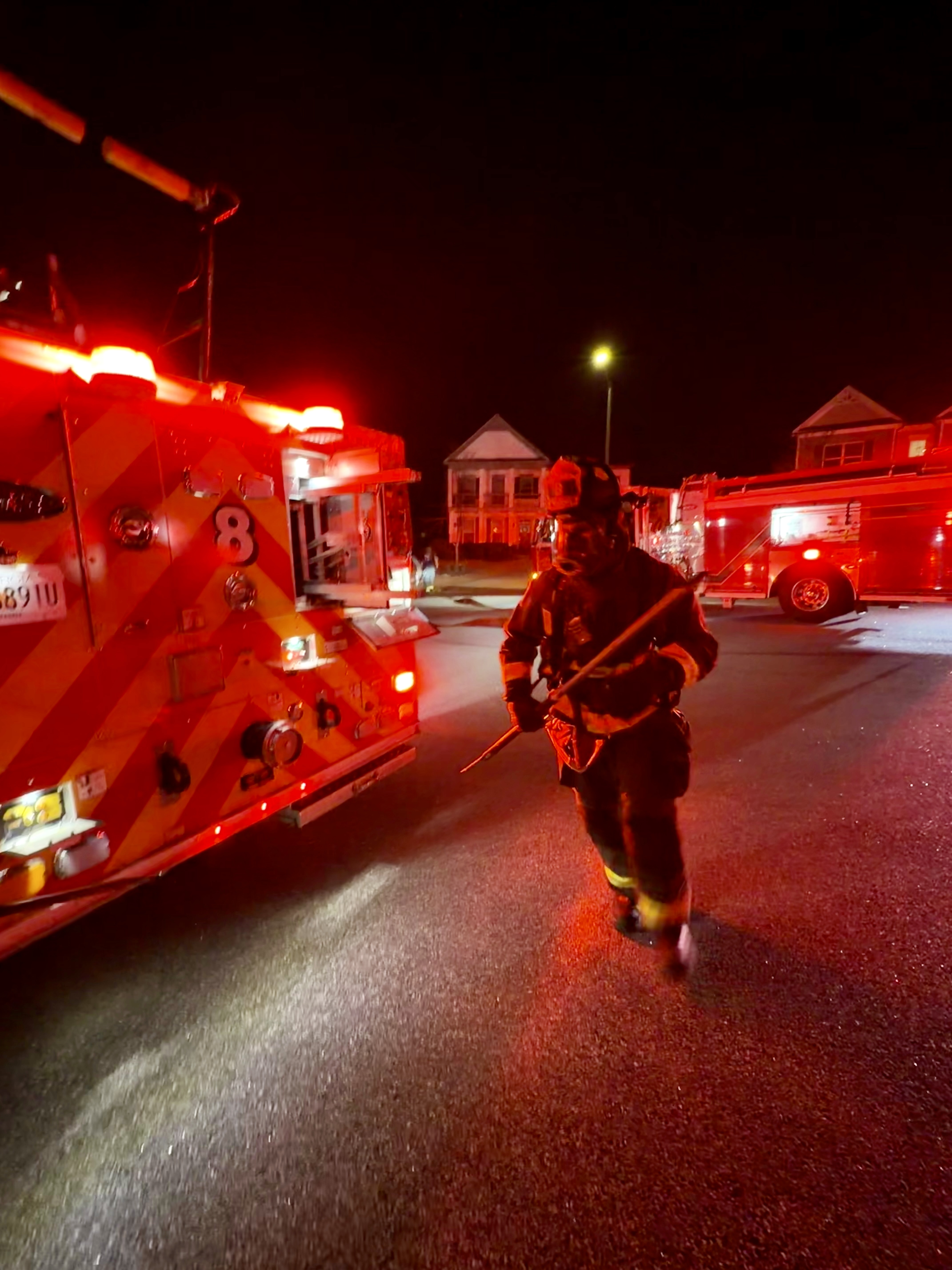 Firefighters work to attack the fire and search the residence. 