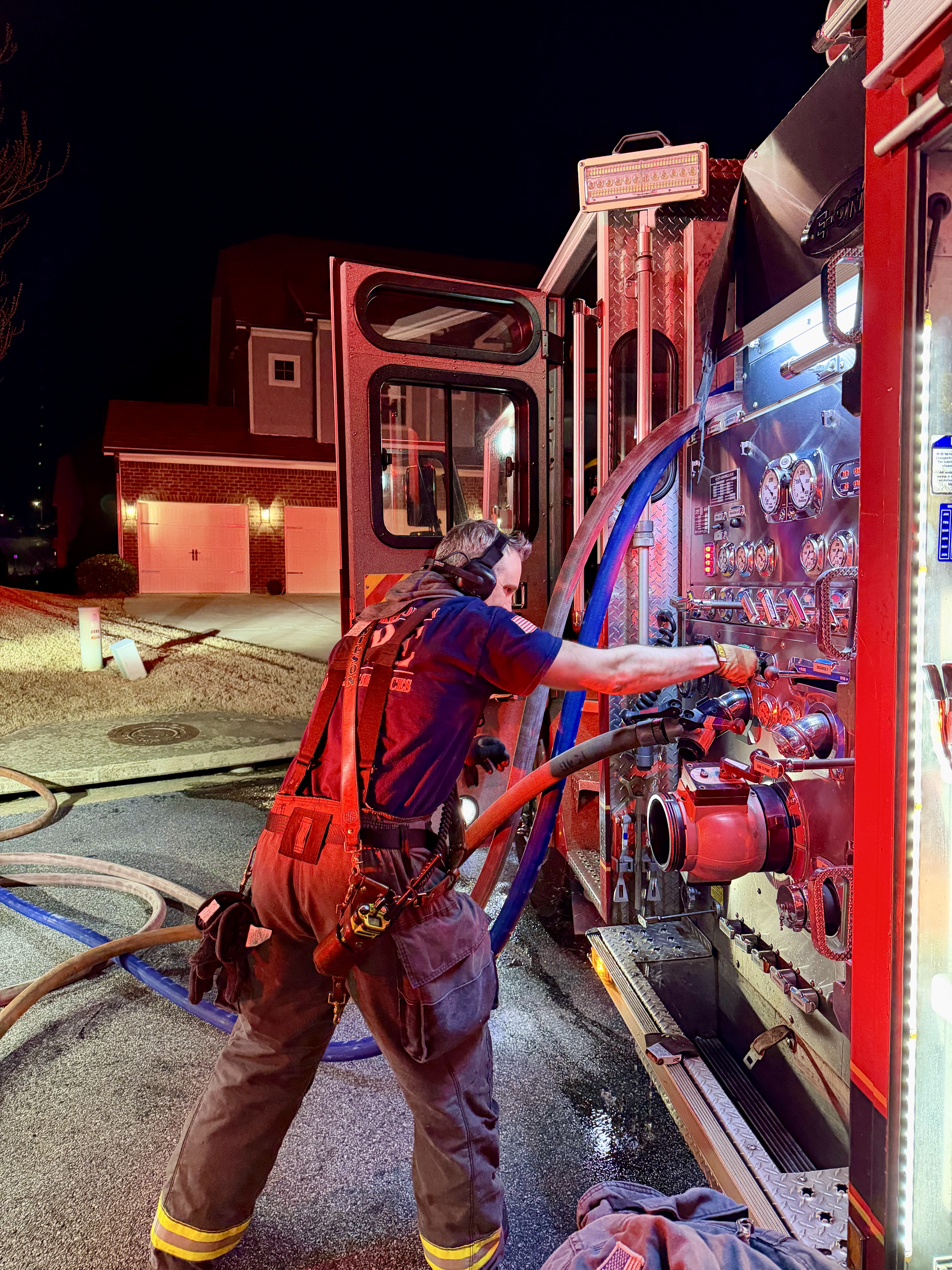Firefighter operates the pump on Engine 23. 